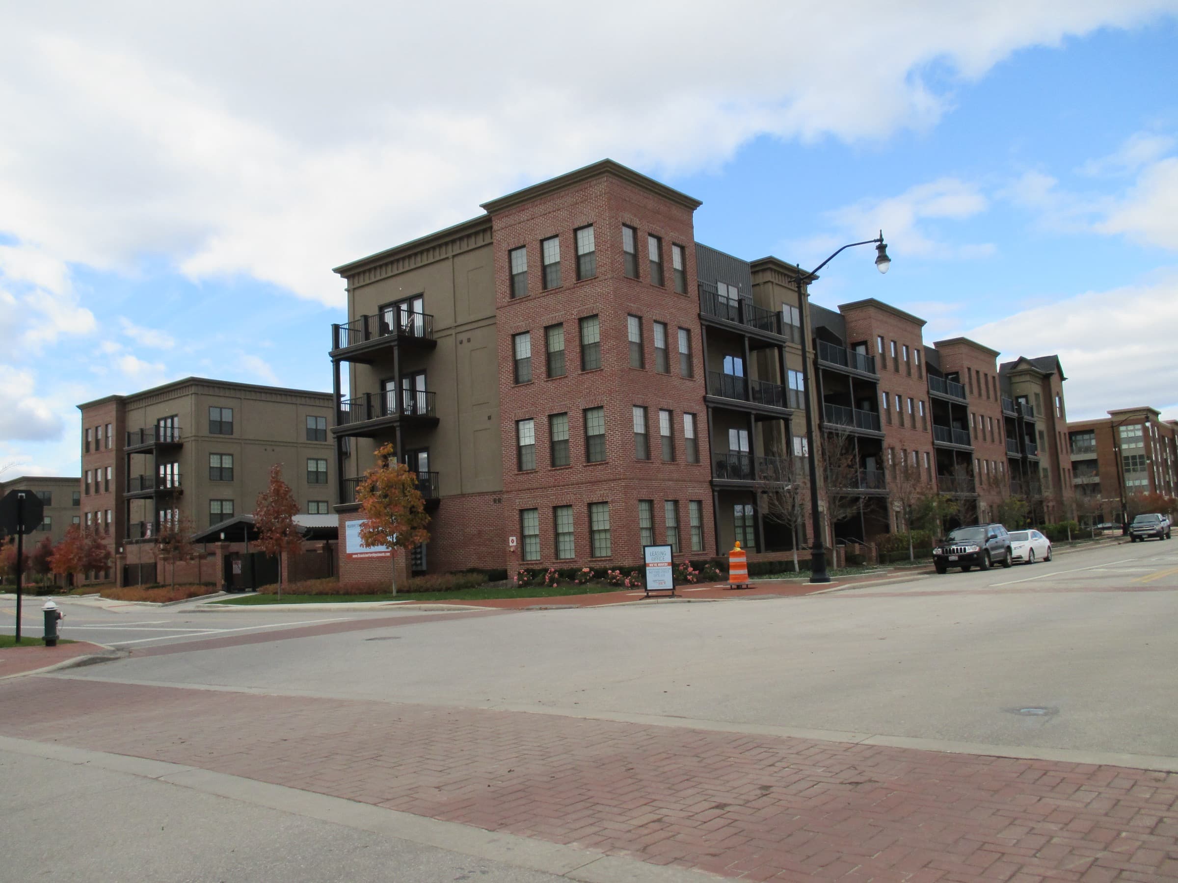 New brick apartment buildings under construction-fresh blue sky at Grandview Yard
